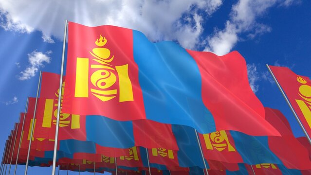 Multiple Mongolia flags waving on blue sky