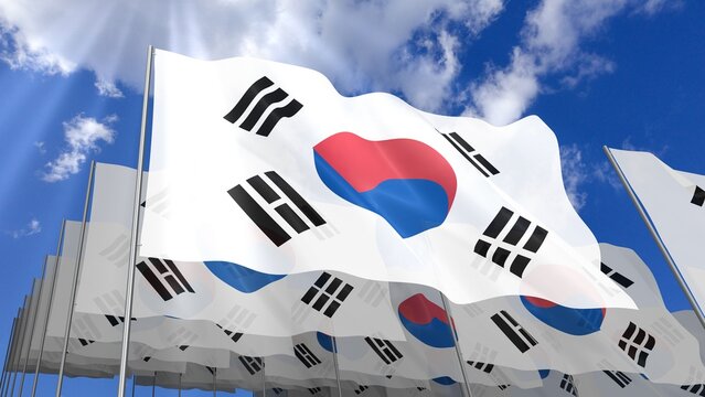 Multiple South Korea flags waving on blue sky