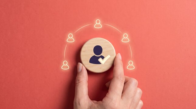 Hand holding wooden token with people network concept