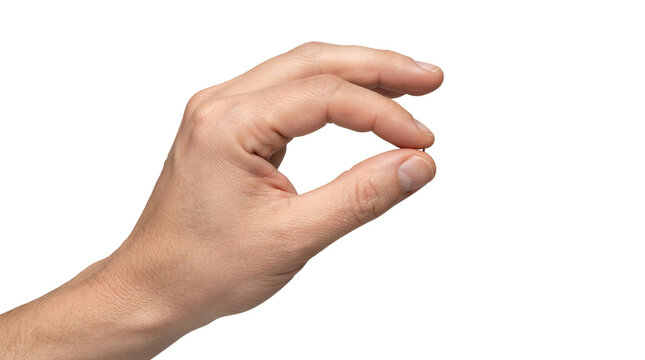 Close-up view of a hand making an ok sign gesture with the thumb and index finger against a plain grey background.