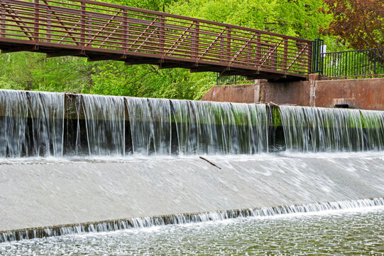 Plunging milky waters under walk bridge