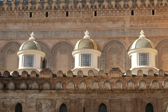 Ornate cathedral domes against a stone facade