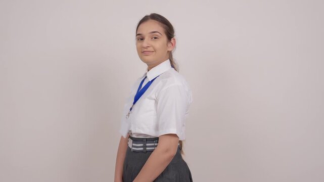 Indian Schoolgirl Turing Around and Smiling at Camera