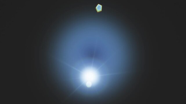 Bright blue lens flare effect glowing brightly against a dark background
