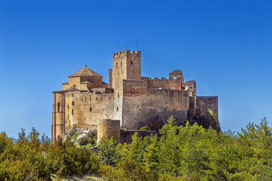 Castle of Loarre in Aragon, Spain, close up rear facade view. Romanesque stone fortress walls and medieval architecture