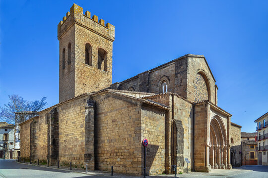 Church of Santiago in Sanguesa, Spain, three quarter view. Medieval romanesque architecture with crenellated stone tower