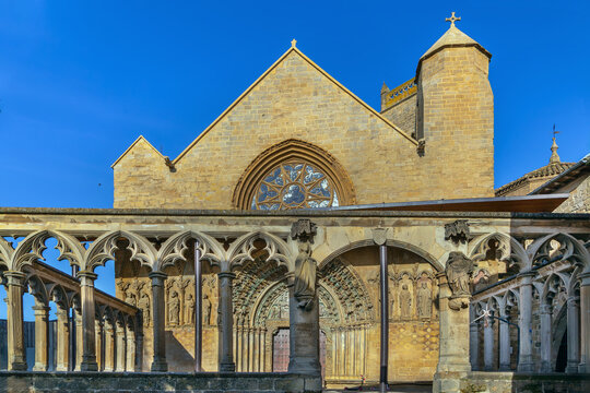 Church of Santa Maria la Real in Olite, Spain, facade view. Gothic architecture with historic stone fence in foreground