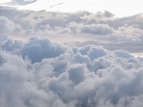 Aerial view of dense white clouds filling the sky over France.