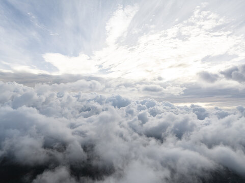 Aerial view of dense white clouds floating in the sky over France.