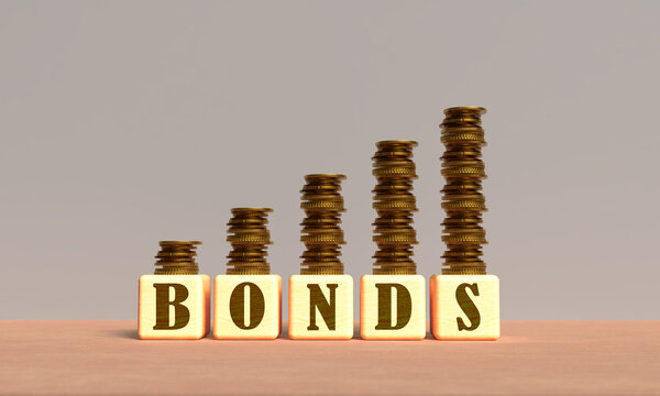 Bonds yield cube block wooden square us usa united state america golden price inflation recession investment bond yield debt finance economy interest rate bonds yield coin golden yellow orange color 
