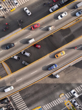 Aerial view of Avenida Abraham Lincoln with heavy traffic flowing through the highway intersection in Santo Domingo, Distrito Nacional, Dominican Republic.