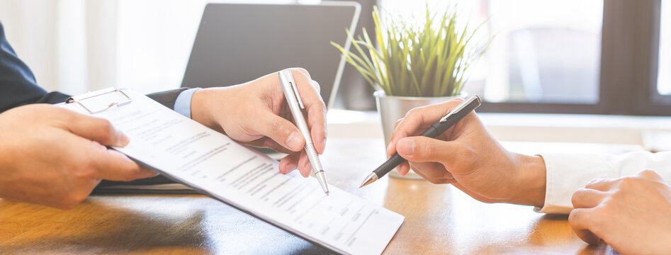 Asian landlord, realtor man pointing on paper for sign signature contract with tenant rental or client, realtor purchase, buyer home or apartment, agreement mortgage, property lease agent concept.
