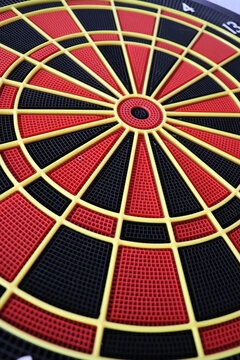 Red and black electronic dartboard target close up