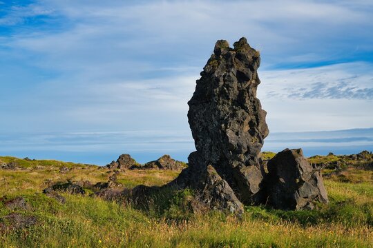 A picturesque cliff coastline between the villages of Hellnar and Arnarstapi in western Iceland.