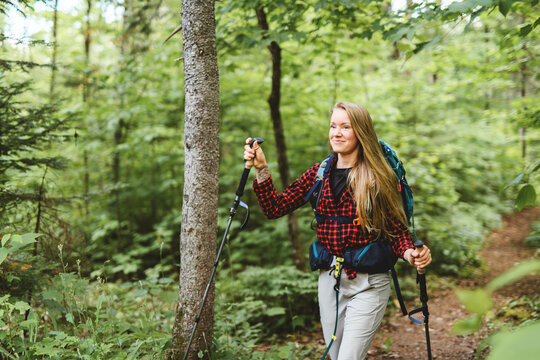 woman trekking in the forest. Traveling activity