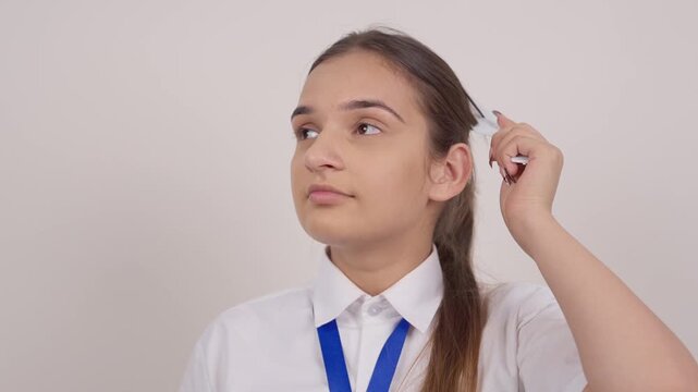 Indian Schoolgirl Combing her Hair