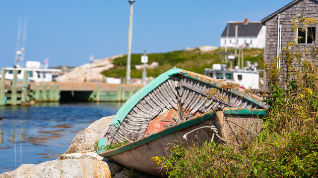 Abandoned Wooden Dory with Peeling Teal Paint at Peggy's Cove Harbour, Nova Scotia