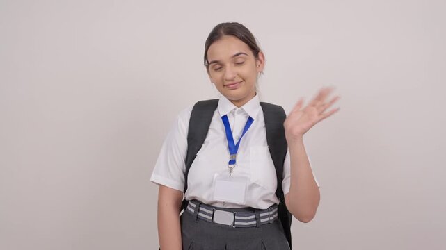 Indian Schoolgirl with Backpack Waving Hi