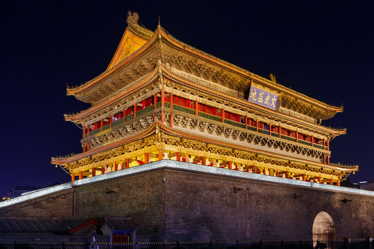 Xi'an, China, illuminated Xi'an Drum Tower at night showing historic chinese architecture and lantern lighting