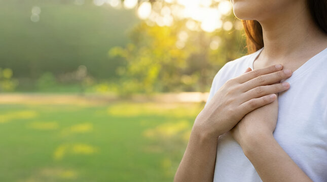 Close-up of unrecognizable person practicing breathing exercises in peaceful park setting representing yoga lifestyle mindfulness and outdoor wellness Close up of unrecognizable doing breathing