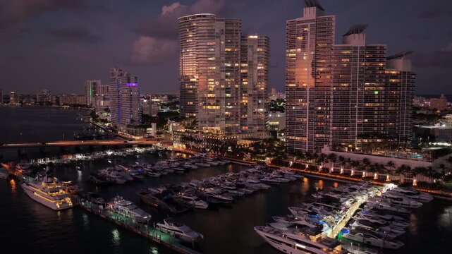 Summer sunset vacation. Luxury South beach marina. Luxury yacht. Miami south beach view. Yacht club. Marina in Miami, Florida on sunset. Nighttime harbor scene. Miami marina with luxury yacht