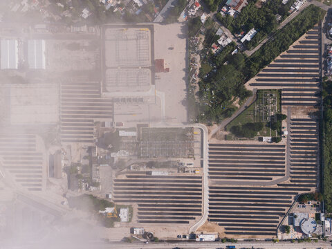 Aerial view of the CFE Merida Area electrical substation featuring extensive solar panel arrays, industrial infrastructure, and power distribution equipment in Merida, Yucatan, Mexico.