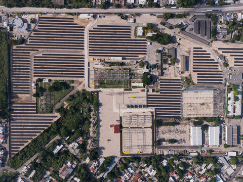 Aerial view of the CFE Merida Area electrical substation and solar panel array, featuring rows of photovoltaic panels and power infrastructure in Merida, Yucatan, Mexico.