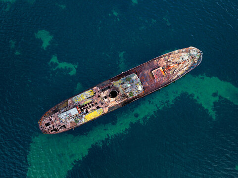 Aerial view of Cheynes II Whale Chaser, a rusted shipwreck resting in clear turquoise waters, Albany, Western Australia, Australia.