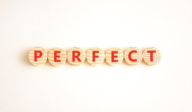 Perfect word symbol. Concept word Perfect on beautiful wooden circles. Beautiful white background. Business perfect word concept. Copy space.