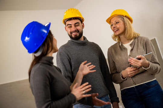 Construction team talking together during a renovation project