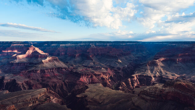 Grand Canyon Panorama with Layered Buttes Under Blue Sky and Clouds, Arizona South Rim Landscape