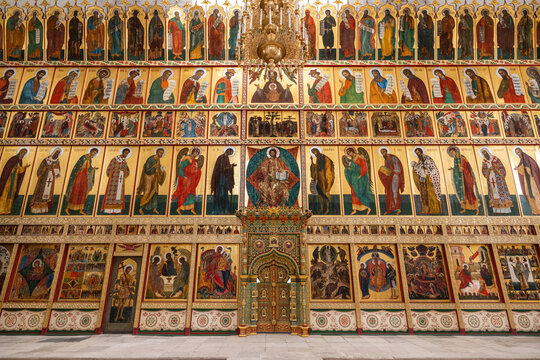 View of the ornate iconostasis of the Solovetsky Monastery featuring rows of religious icons and golden frames in Solovetsky, Arkhangelsk Oblast, Russia.
