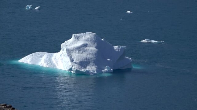 Zodiac Cruising Past Massive Iceberg Near Disko Bay
Zodiac boat cruises past massive iceberg near Disko Bay, Western Greenland, 26 August 2026.
