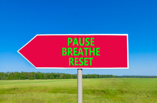 Pause breathe reset words symbol. Concept words Pause breathe reset on beautiful road sign. Beautiful blue sky background. Business support motivational pause breathe reset concept. Copy space.