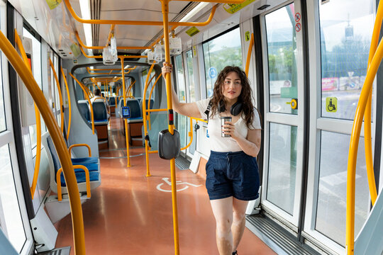 Woman with vitiligo commuting on murcia tram, traveling through city on public transport