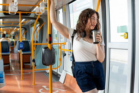 Woman with vitiligo enjoying urban transport on a murcia tram journey