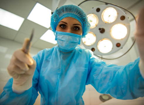 Female Surgeon Operating.
