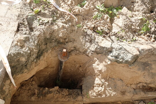 Metal element sticking out of the ground at a construction site
