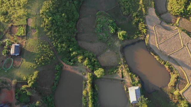 Aerial footage showcasing the patchwork of rice terraces, ponds, and lush greenery surrounding Lake Ho Pa Khoang near Dien Bien Phu in northwestern Vietnam.
