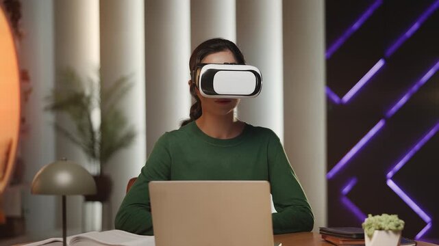 Asian female student uses VR headset for interactive online education at home