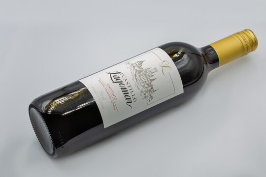 Castillo Lagomar Spanish red wine bottle closeup on white.