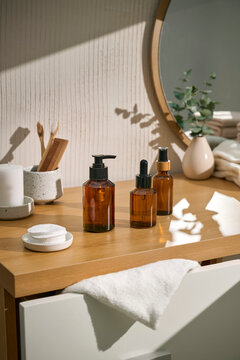 Amber glass bottles and personal care products in bathroom