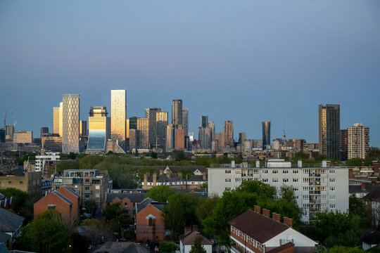 Canary Wharf Skyline Illuminated By Evening Sun In London