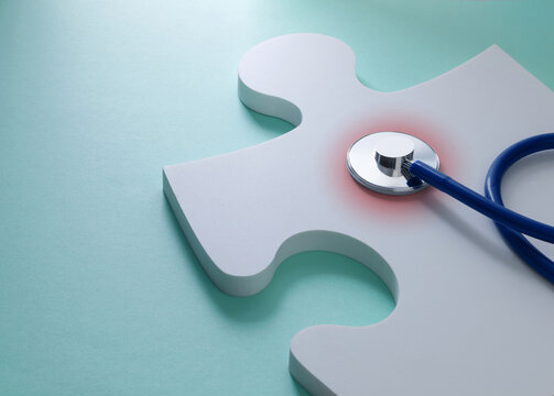 Glowing Stethoscope on Puzzle Piece Representing Medical Research and Solutions