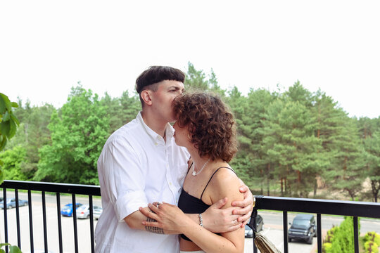 A couple is spending time  on the balcony 