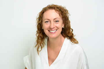 Fototapeta premium Happy mature woman on studio white background with nice portrait