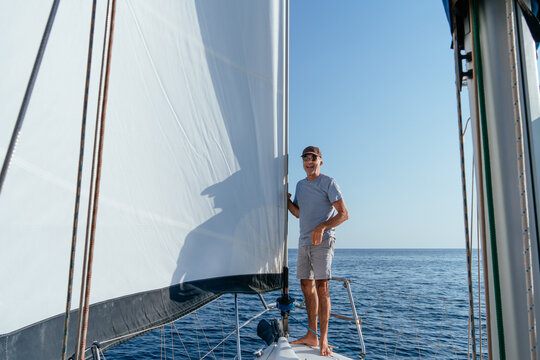 Senior man enjoying sailing trip on ocean