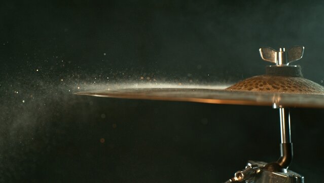 Golden Glitter and White Powder Explosion From Cymbal