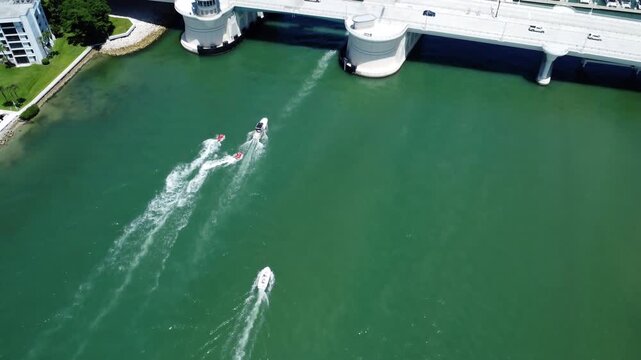 Waverunners falling in behind boat drone shot