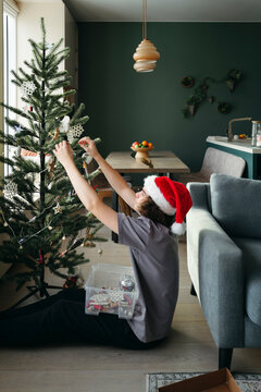 Decorating a Christmas Tree Brings Joy and Warmth to the Home